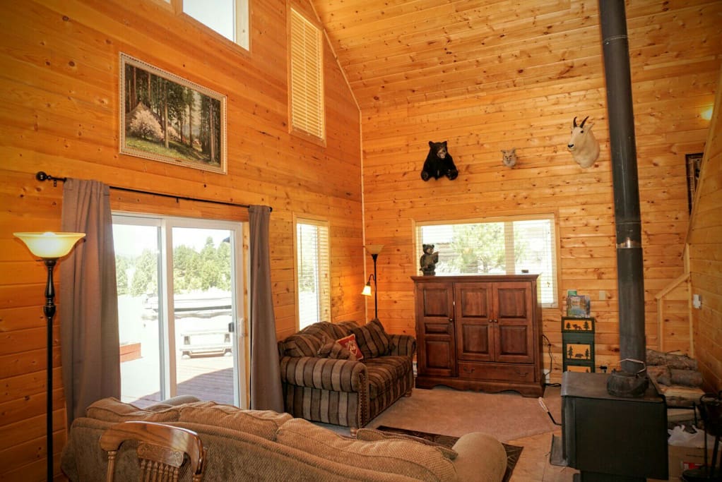 The comfortable lounging living area of the cabin, along with a tv located in the cabinet. There is also internet tv.
