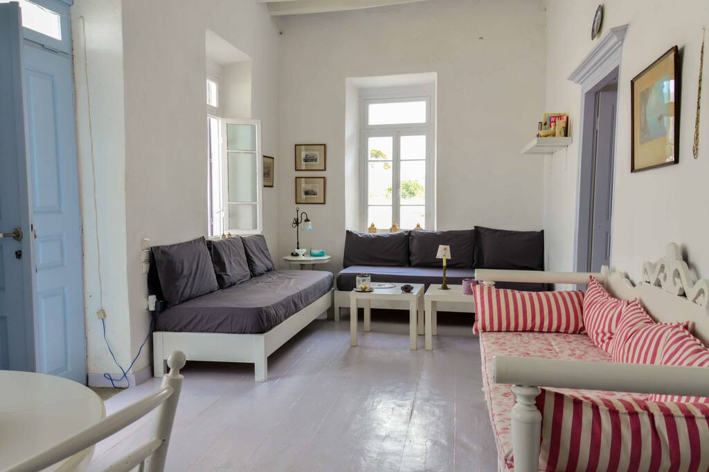 Spacious living room with couches doubling as beds.