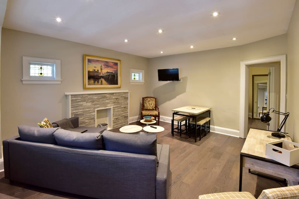 Living room with TV, dining table and desk
