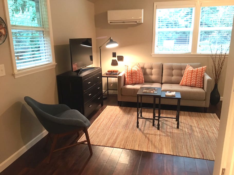 Comfy couch with TV that can be viewed from the bed, couch or kitchen