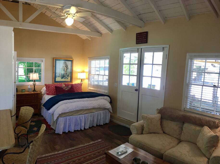 Your queen size bed with therapeutic mattress topper,down comforter, plenty of pillows