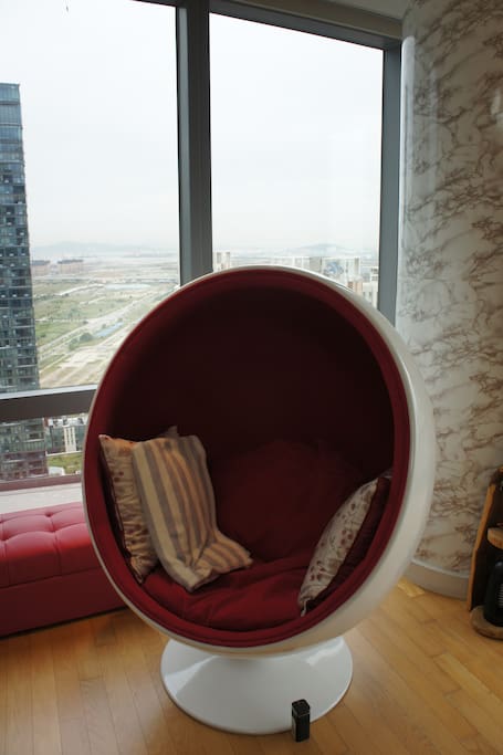 A close-up of the red egg chair.
