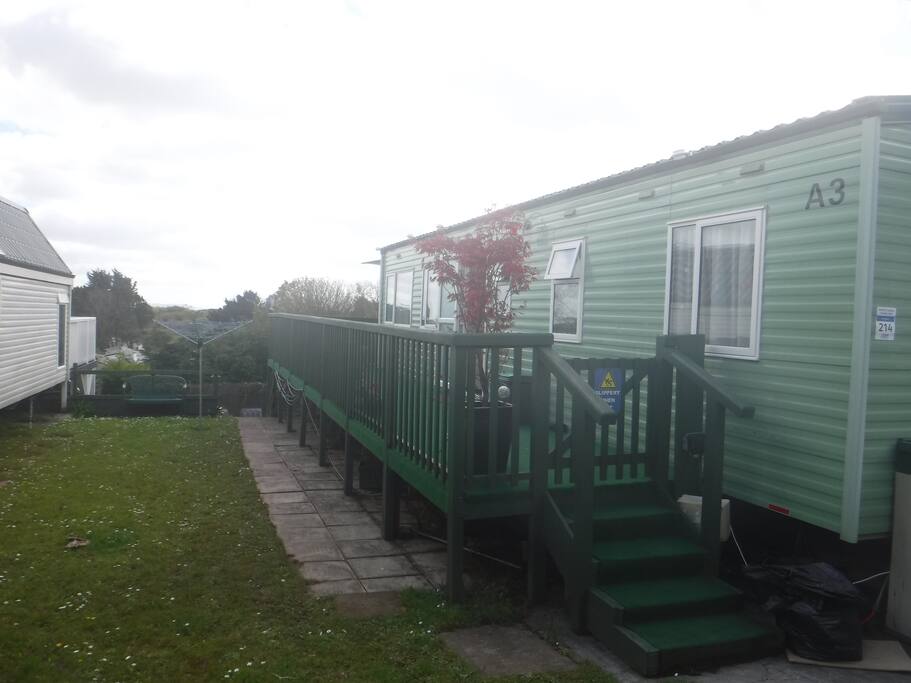 Path leading to lower decking and barbeque are