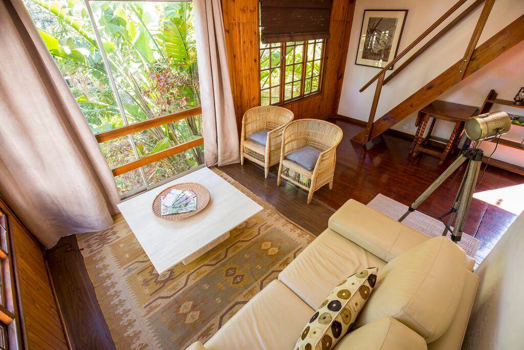 The sliding door in the lounge area opens up onto a view of the garden.