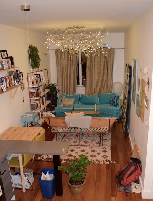 Comfy living room with partial view of the kitchen.