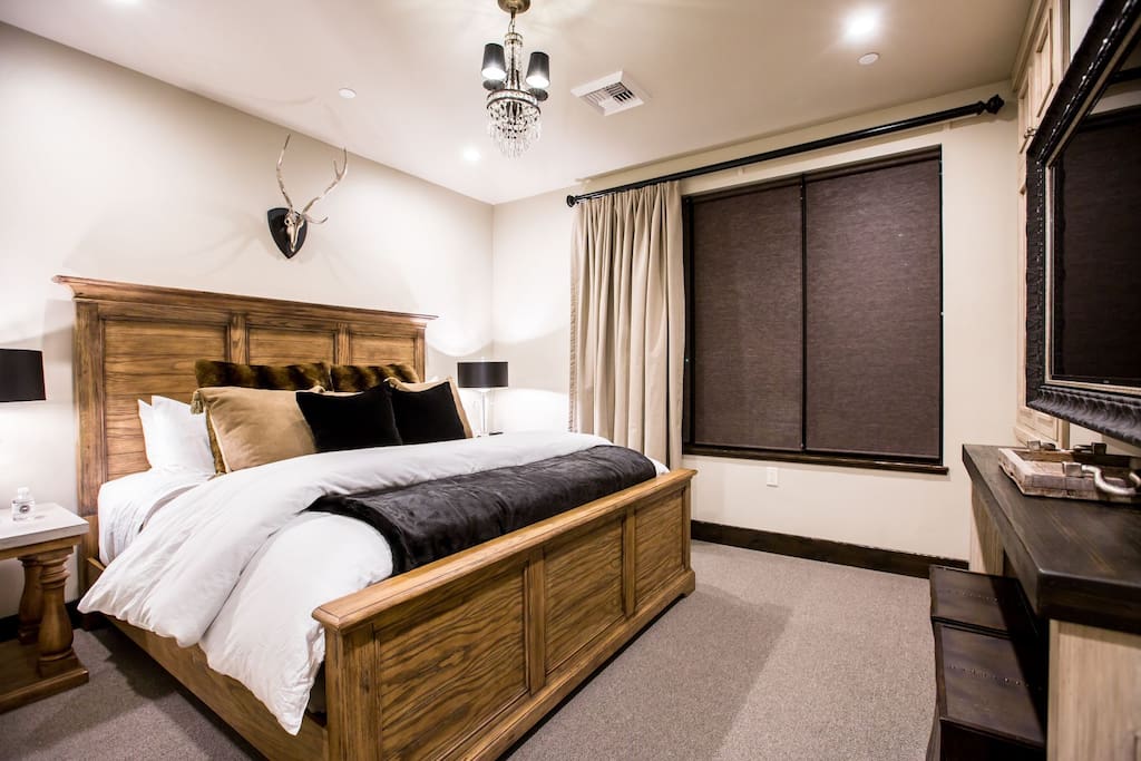 Bedroom with King bed, fire place, and TV