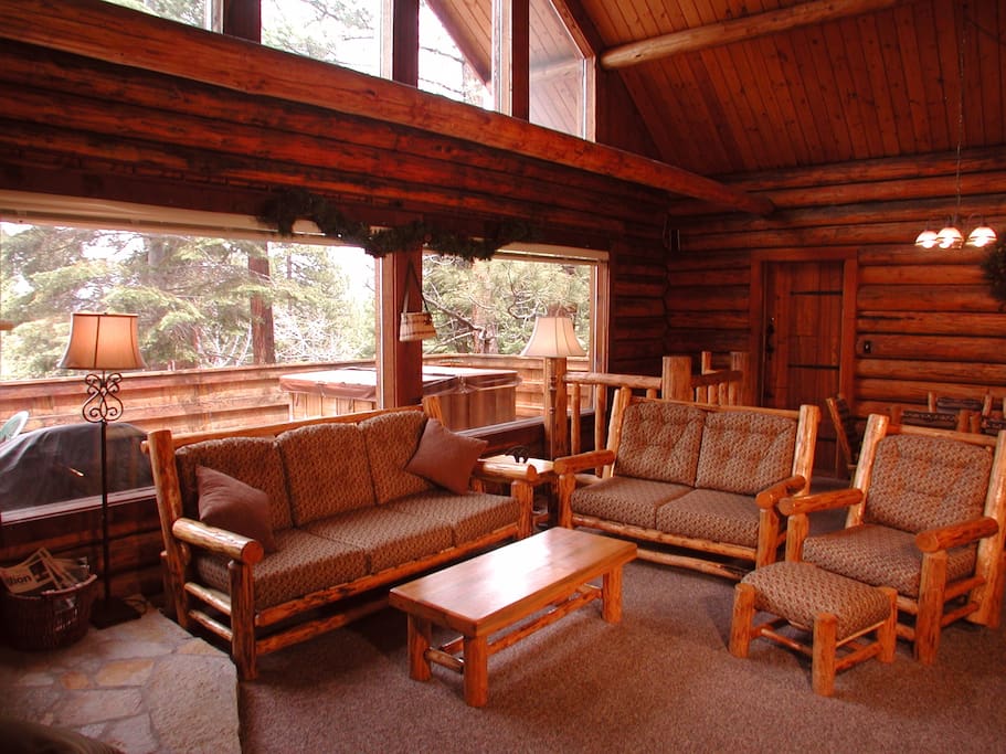 Living room with Cathedral Ceilings, Flat Screen and tons of glass!