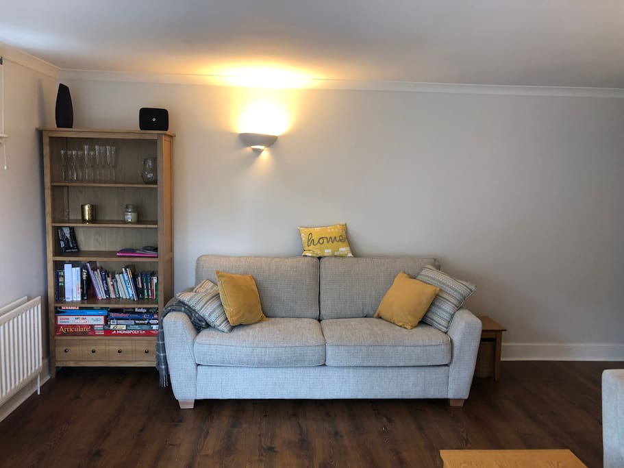 Spacious Living Room with Dining Area and Comfy Sofa Bed