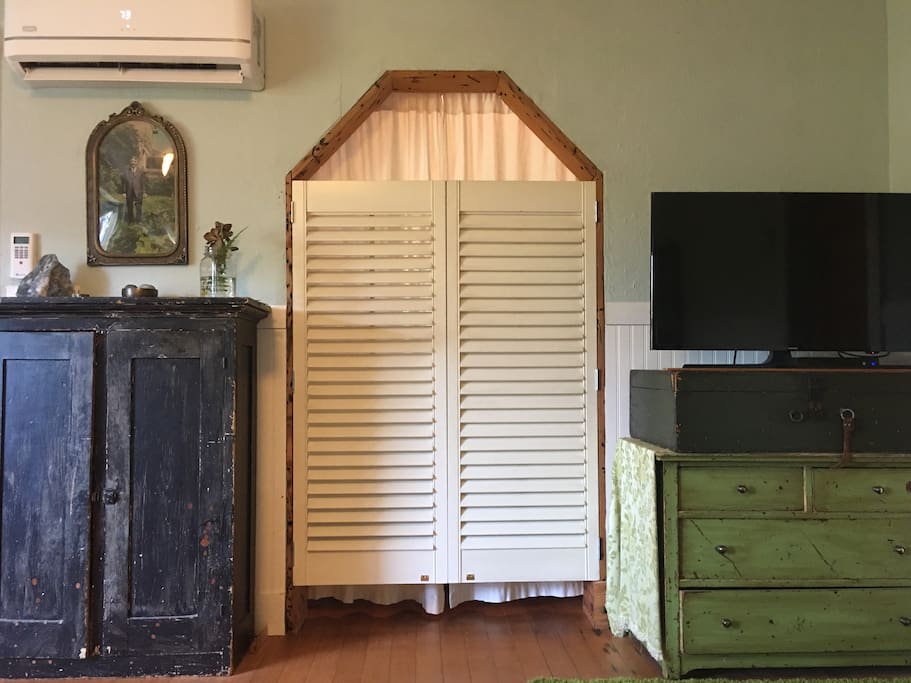 Shutter doors and curtains to nook.