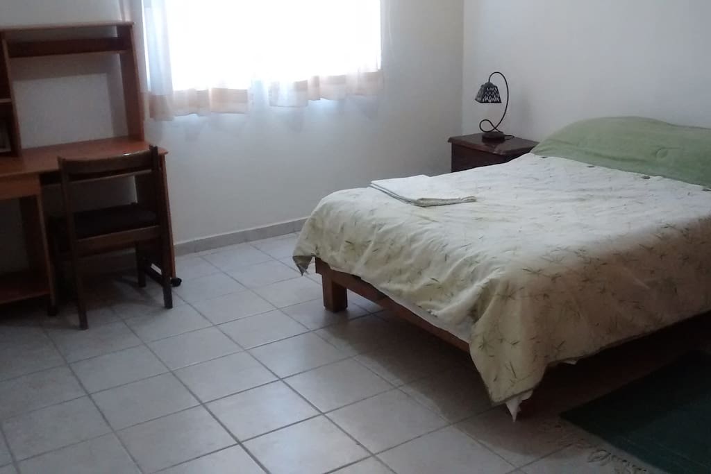 Same bedroom, other view. Desk or table included.