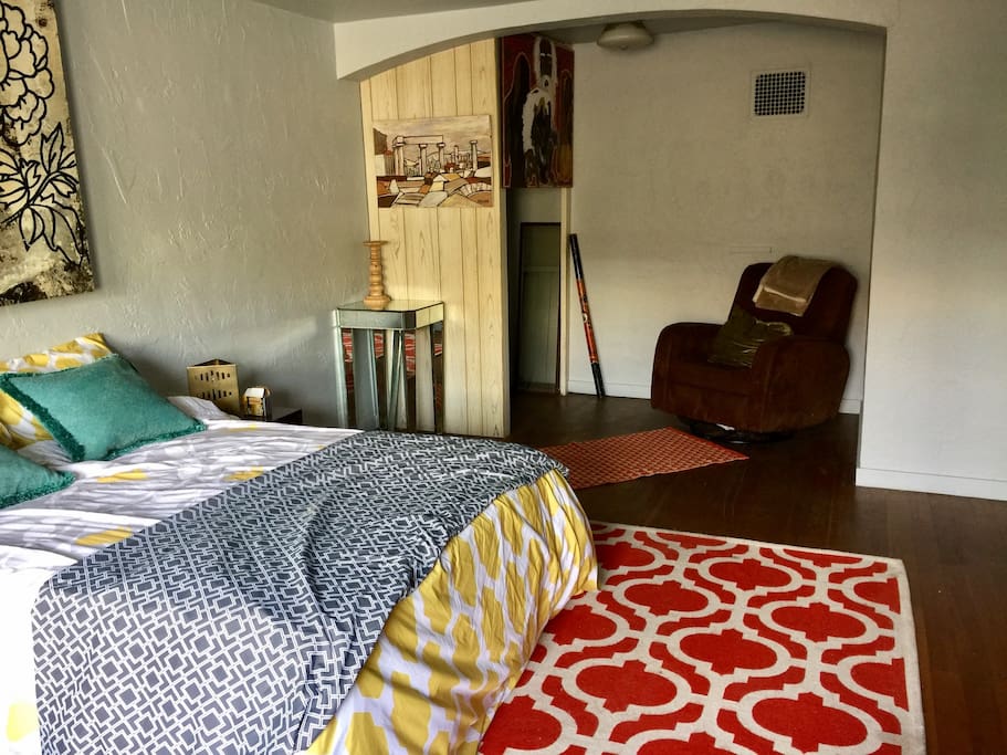double bed, recliner chair, closet for hanging clothes