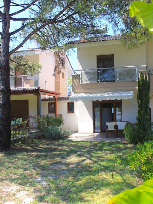 Entrance to the house. Outside terrace and balcony, view from our garden.