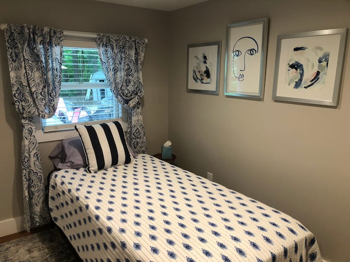 This cozy room has a trundle bed that will adjust to the same height as the bed, great for any age.
