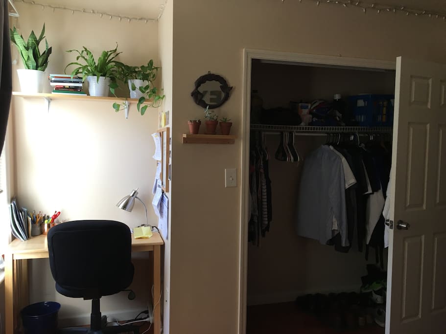 A small desk work place and closet