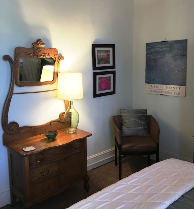 Antique furnishings and eclectic art create a unique setting.