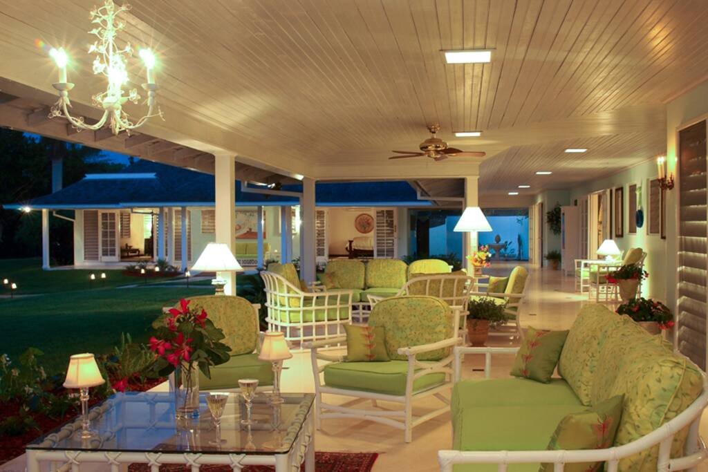 The favorite gathering place for conversation and the tranquil view is the 125-foot L-shaped verandah with Italian marble tiled wet bar.