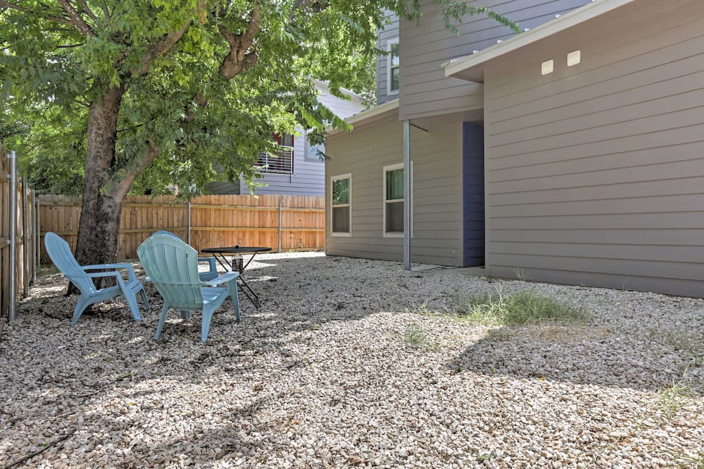 The home has a spacious, fenced-in backyard where you can sit back and soak up the sun.