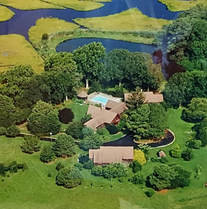 Aerial view of the property; very private with trees and water all around you!