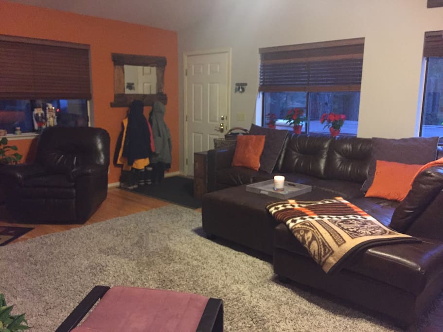 Our HUGE comfy wrap around couch. The tray on the ottoman makes it serve nicely as a 'coffee table', when its not pushed in to make the couch even bigger for Netflix evenings.