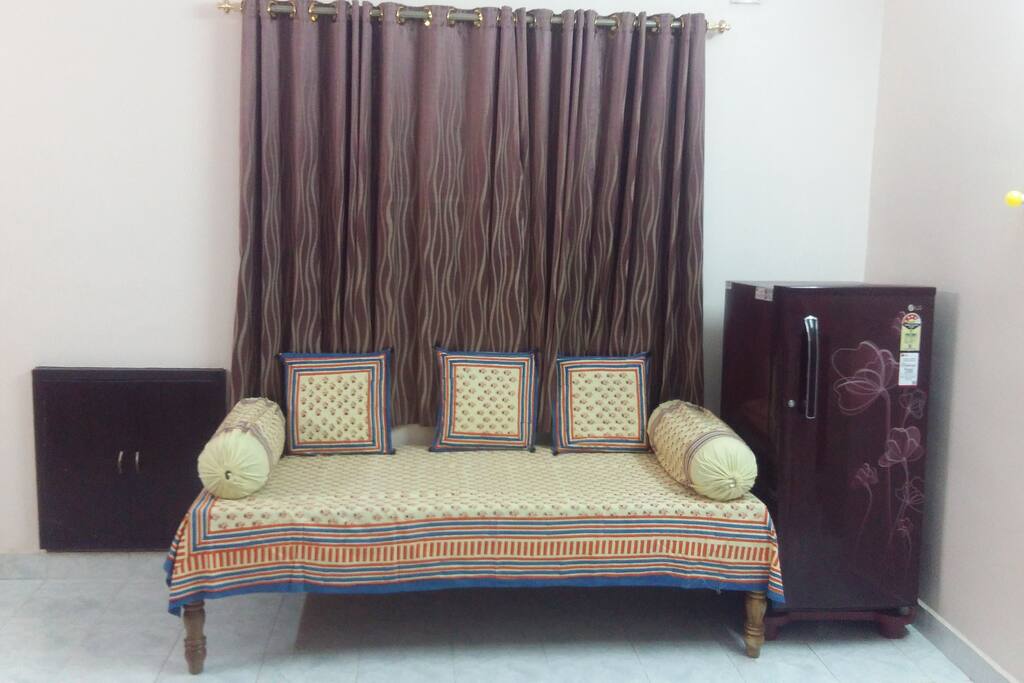 Day bed / Divan in the Living room, with a Fridge