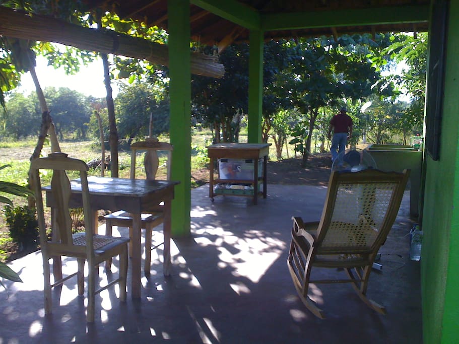 nice shaded hang/outdoor ktichen with stand up fan