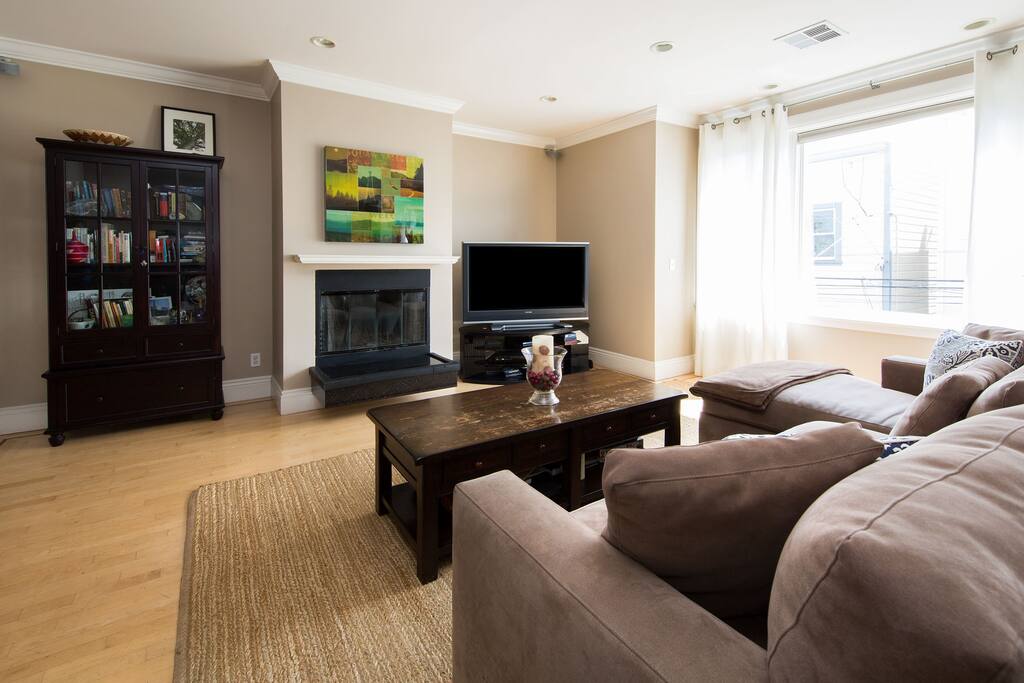Living room with flatscreen TV and working fireplace