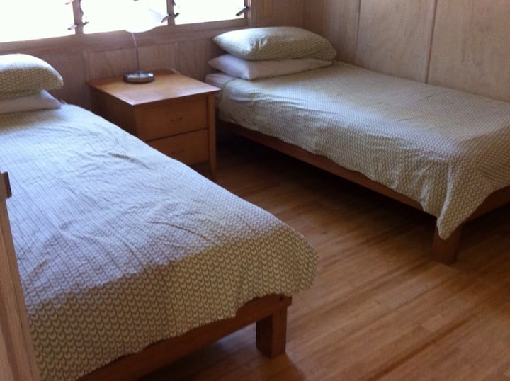 The second bedroom has 2 single beds