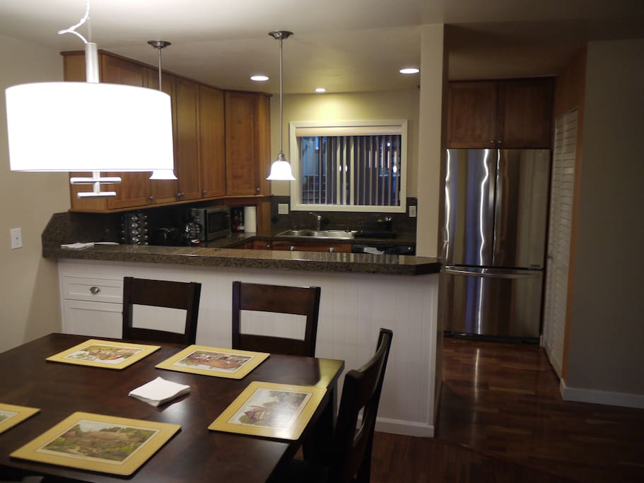 Dining area with view of kitchen