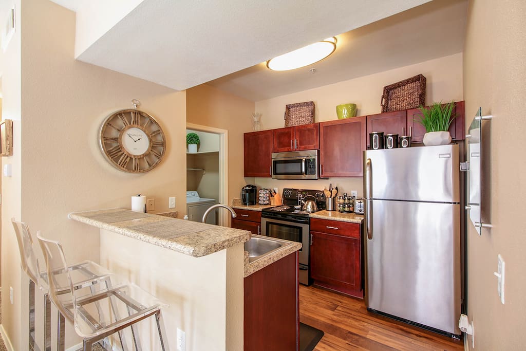 Beautiful modern kitchen with a bar table for two, covering all of your basic cooking needs.