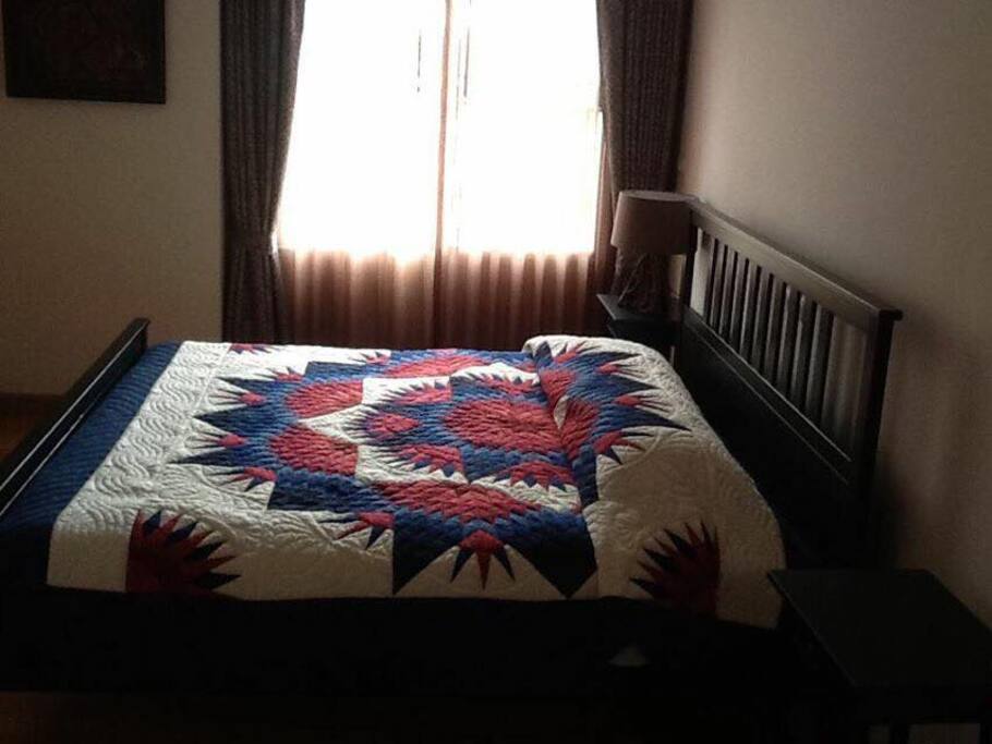 Large sunny bedroom with wardrobe and separate bathroom