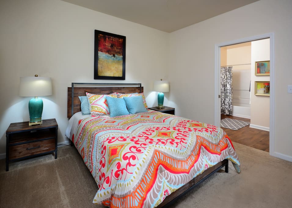 Back bedroom (colors and furniture may vary)