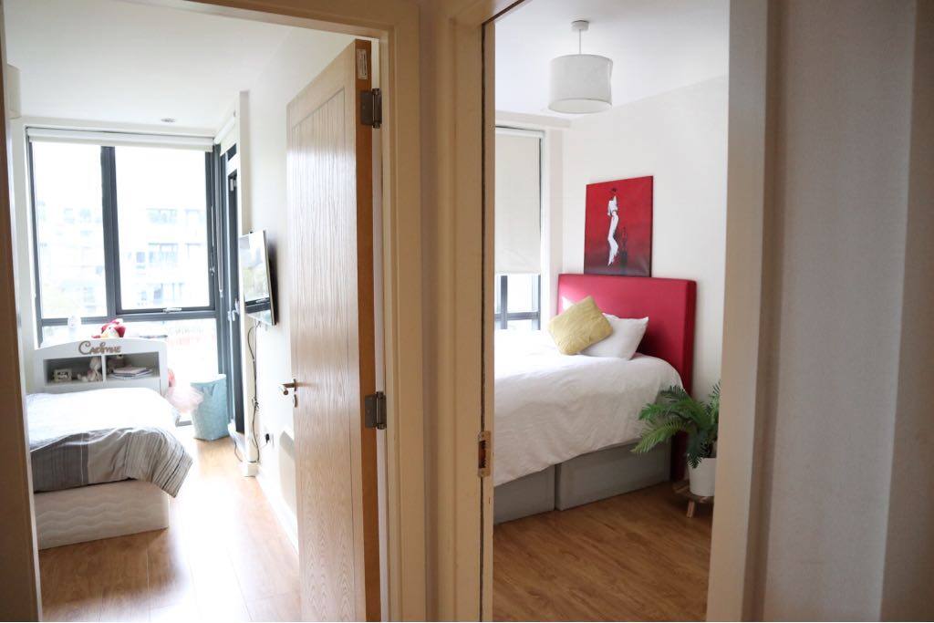 Hallway leading to both bedroom with separate entrance