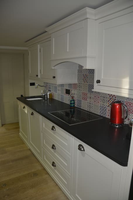 Fully Equipped Kitchen with oven, Microwave, fridge, crockery, cutlery and everything you may need.