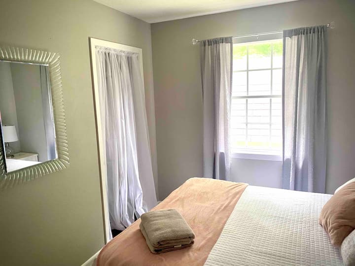 Another view of the third bedroom with a queen bed.