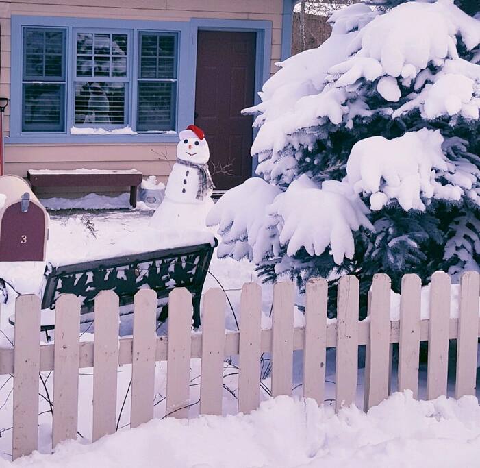 A local welcomes you to the front door at Willow Cottage.