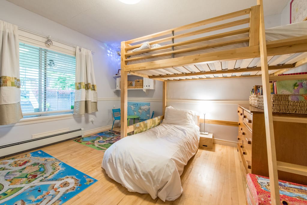 Children's bedroom off the main living space with a double loft bed (can sleep two adults) and a toddler bed.