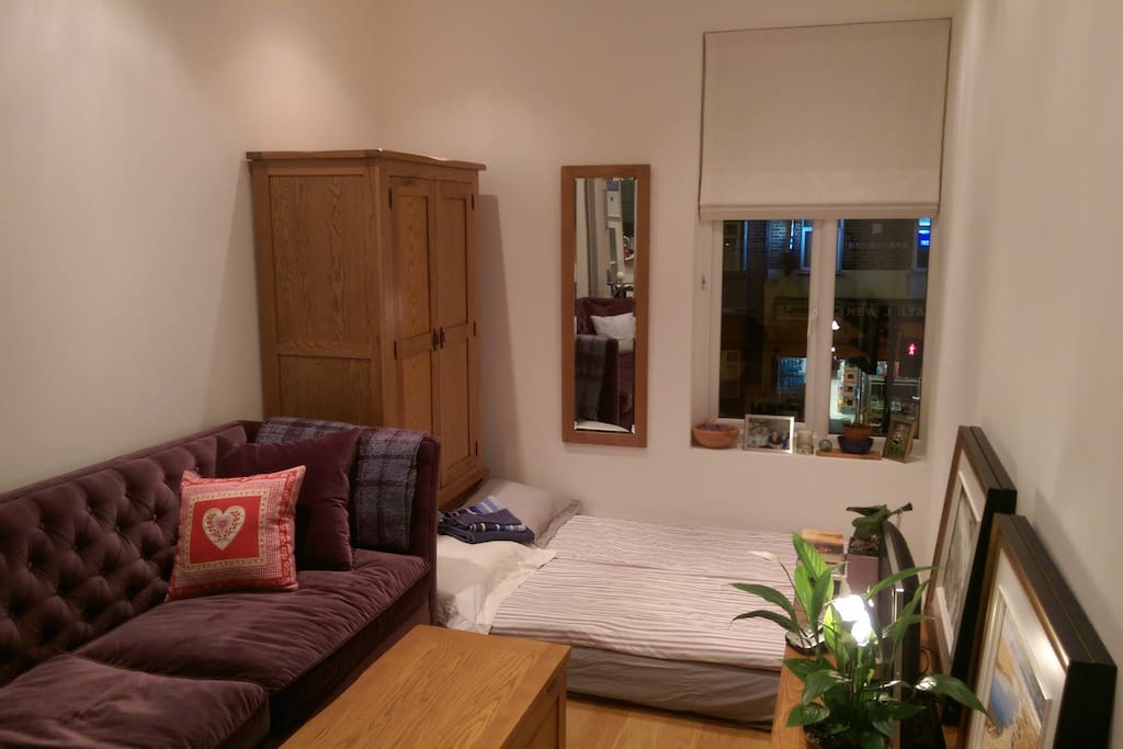 This is what the space in the living room looks like when it is set up for someone extra. The bed is an automatic blow-up air mattress (120cm*190cm), and appropriate for 2 children or 1 adult.