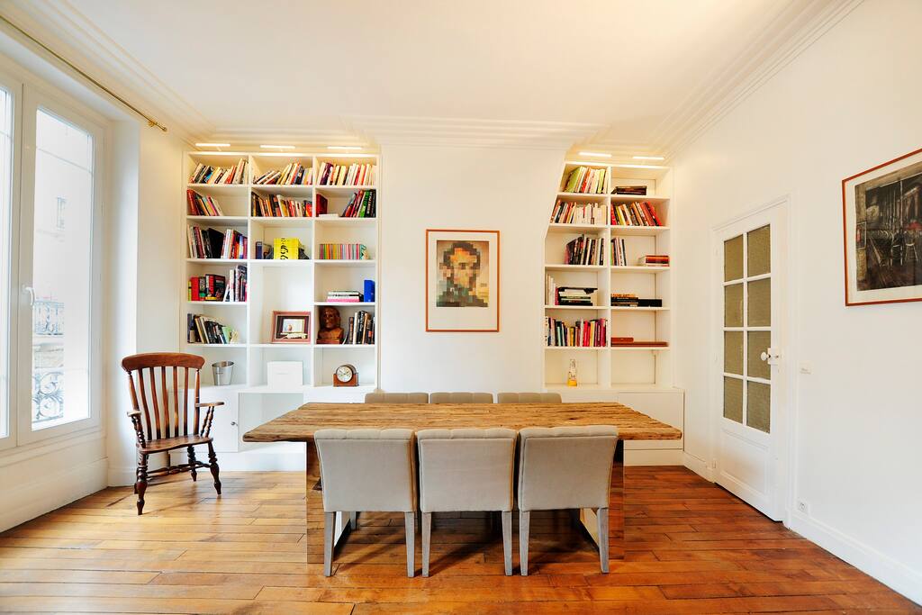 Dining area can host 8 guest comfortably. The bookshelf is full of interesting books