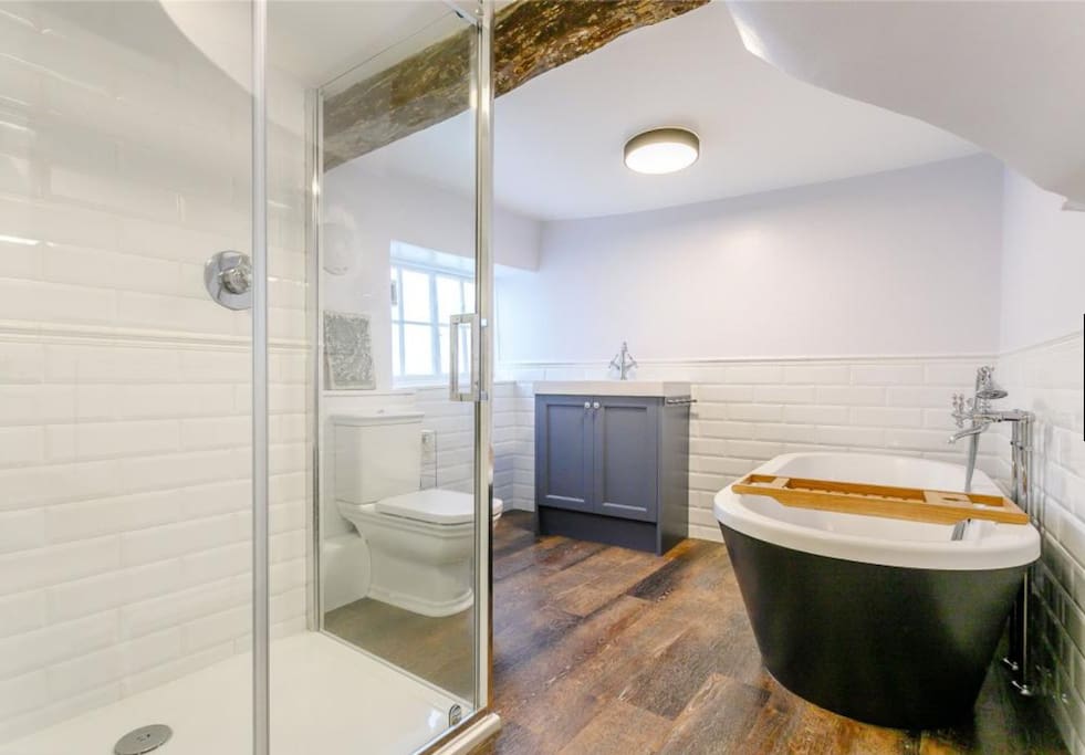 Private bathroom with Italian shower and free standing bath