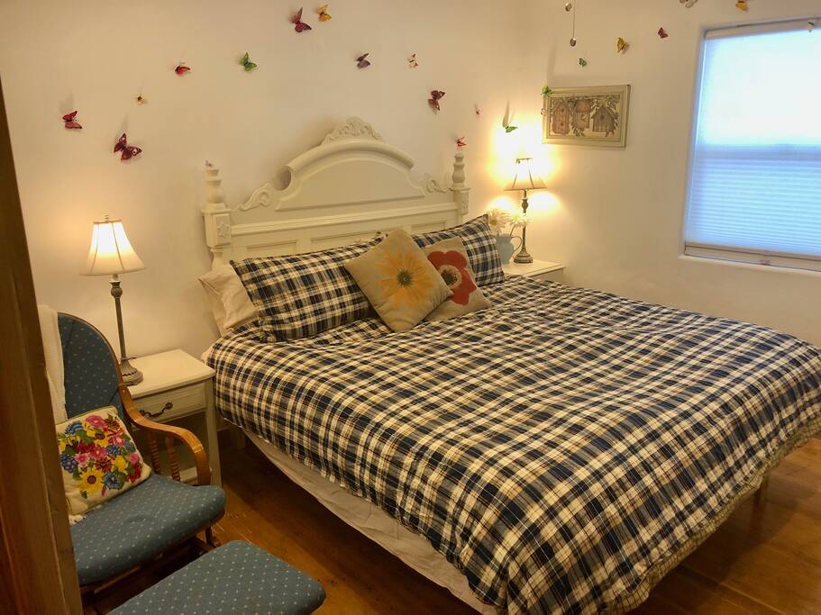 At each side of the bed in the Master Bedroom you'll find a night stand. One side has a charging station for USB and the more-modern USB-C devices. There's also a wooden rocker/glider and ottoman to relax on.