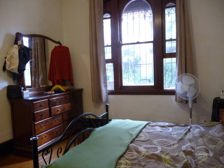 Your room with a big window facing a calm side street in culinary Surry Hills.
