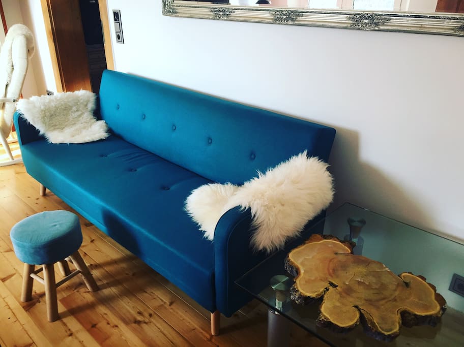Cozy couch and real wooden floor (also usable as sleeping couch)