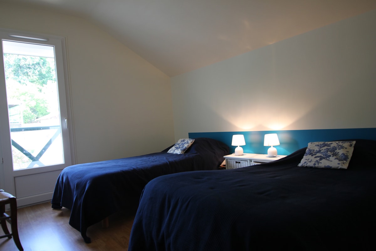 The first bedroom upstairs with two double beds. Possibility of making a single bed on request. 