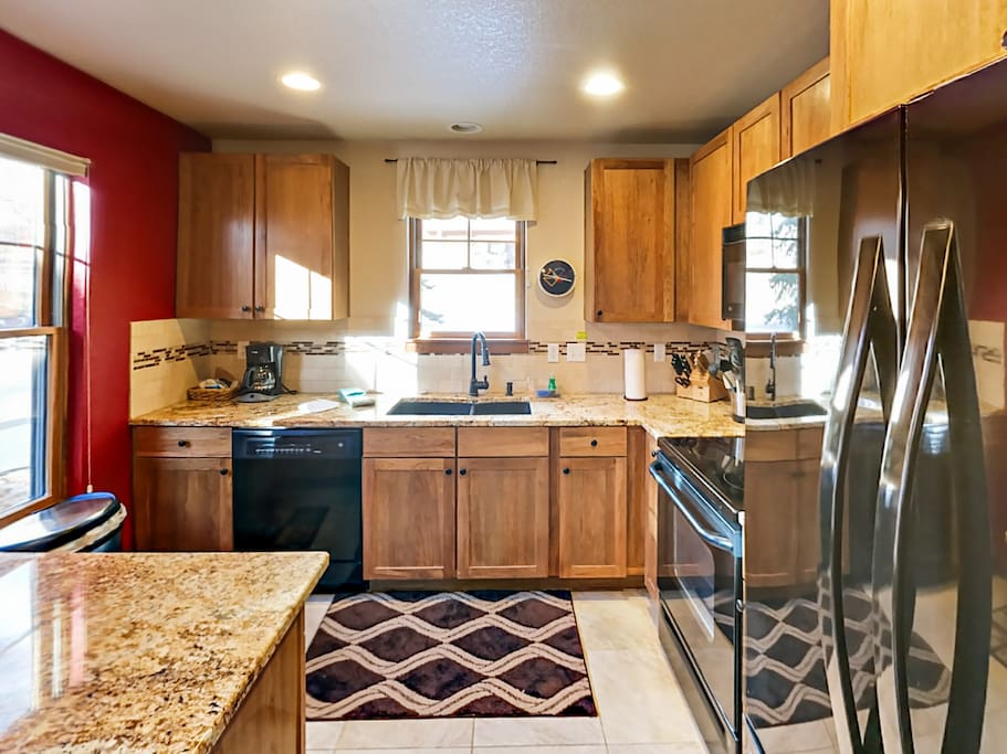 The well-stocked kitchen includes a starter supply of kitchen amenities (dish soap, paper towels) for your convenience.