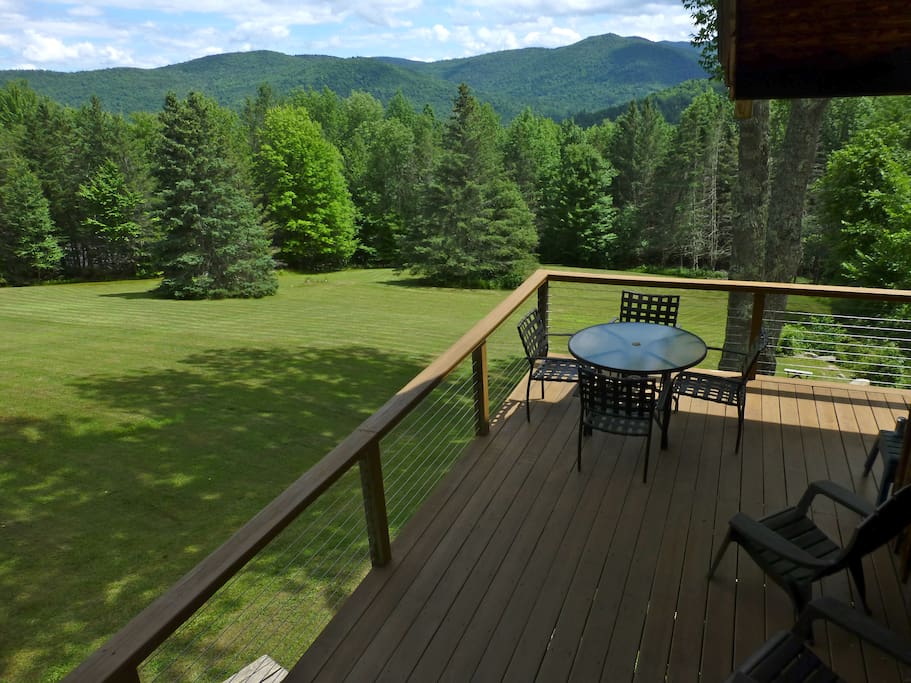 Wrap around porch overlooking the meadow & the mountains