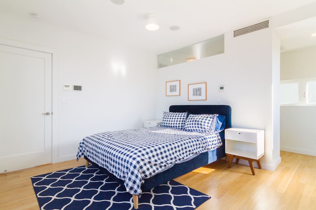 Master Bedroom - Queen Bed - Sleeps 2 people. The en suite bathroom is accessed through that opening on the right.