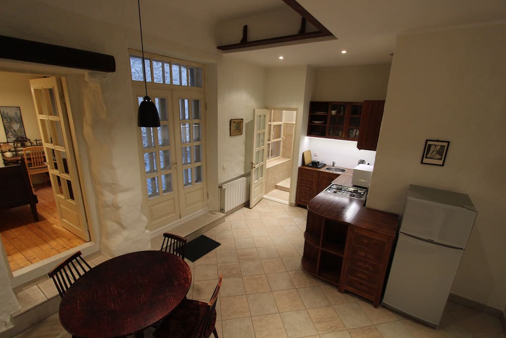 Panorama of the kitchen and dinning area. Second small bedroom and terrace entrance on the left of the photo.