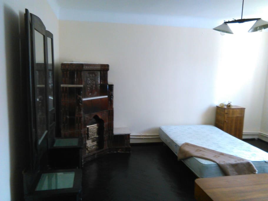 Big bed and fire stove.