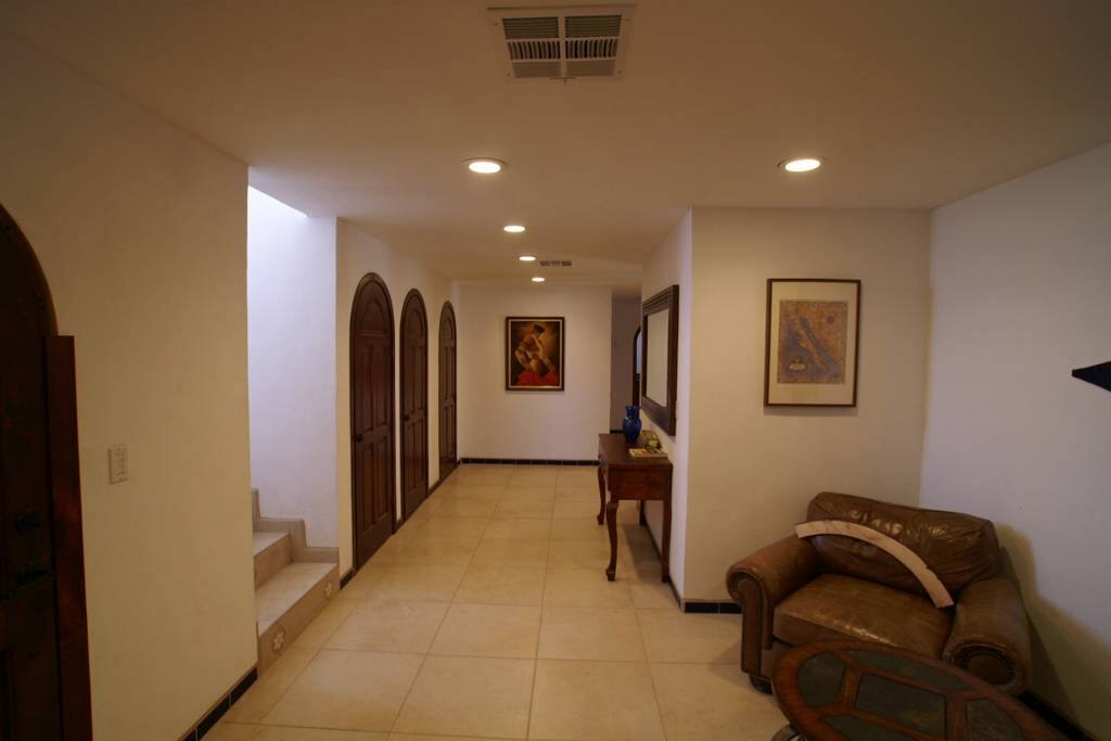 Entryway leading to the hallway downstairs and stairway up