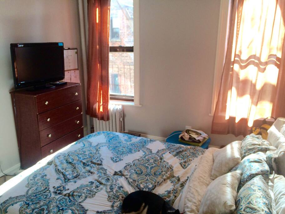 The most comfortable queen sized bed you'll ever sleep on (memory foam)! Along with a 32in flatscreen TV setup with Chromecast, and access to the fire escape.